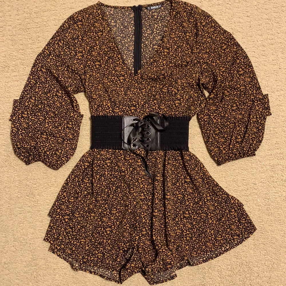 Long sleeve black/orange patterned romper